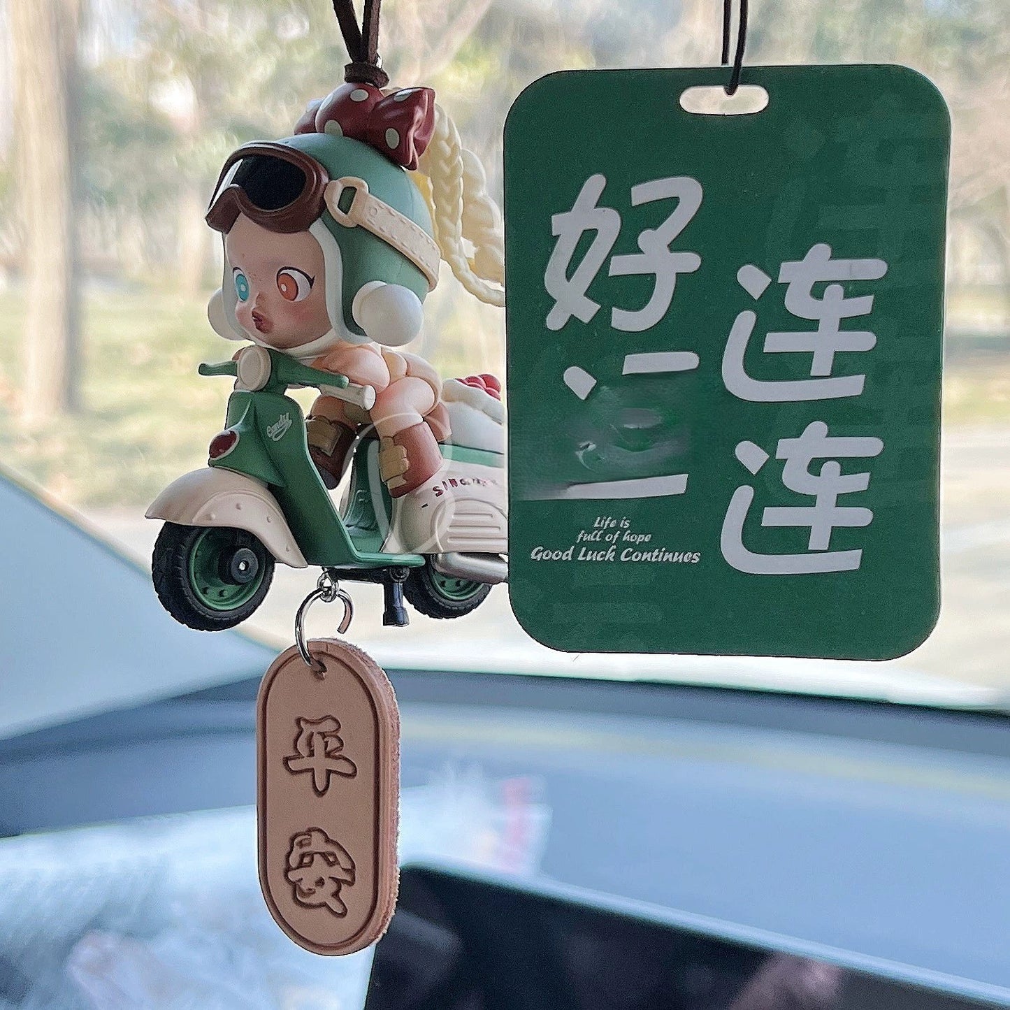 DriveHustle Morning Rush limited edition taxi driver dashboard figurine with motivational tag hanging in car interior