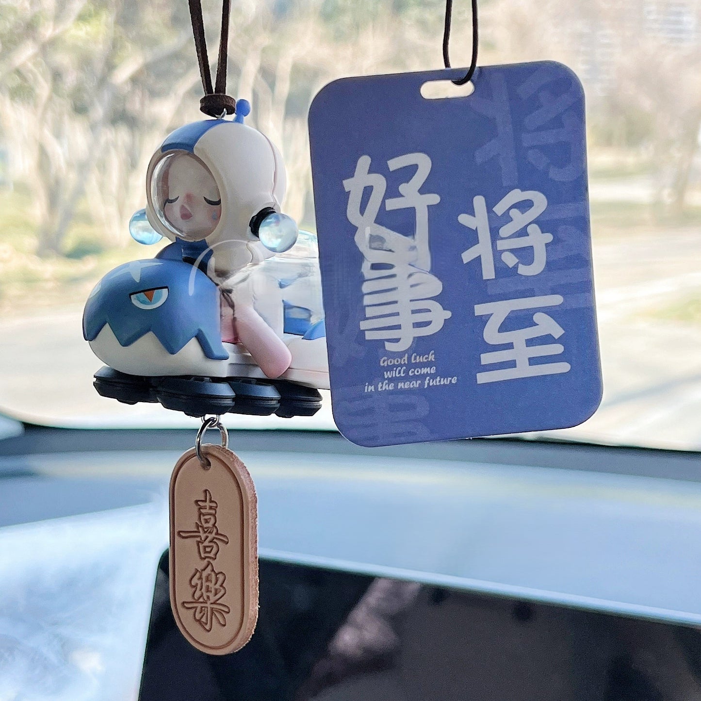 DriveHustle Morning Rush limited edition taxi driver dashboard figurine with motivational tag hanging in car interior