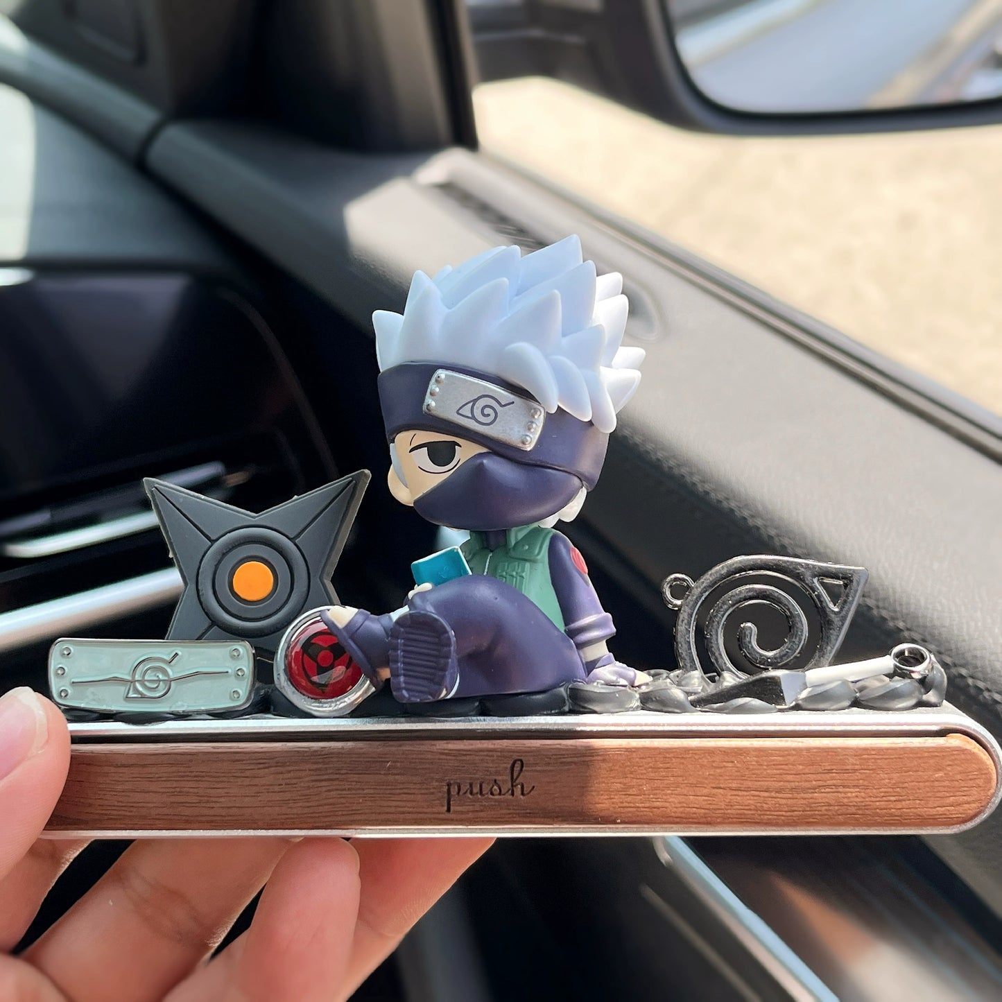 Ninja anime-style dashboard ornament with hidden magnetic parking number plate and gift box