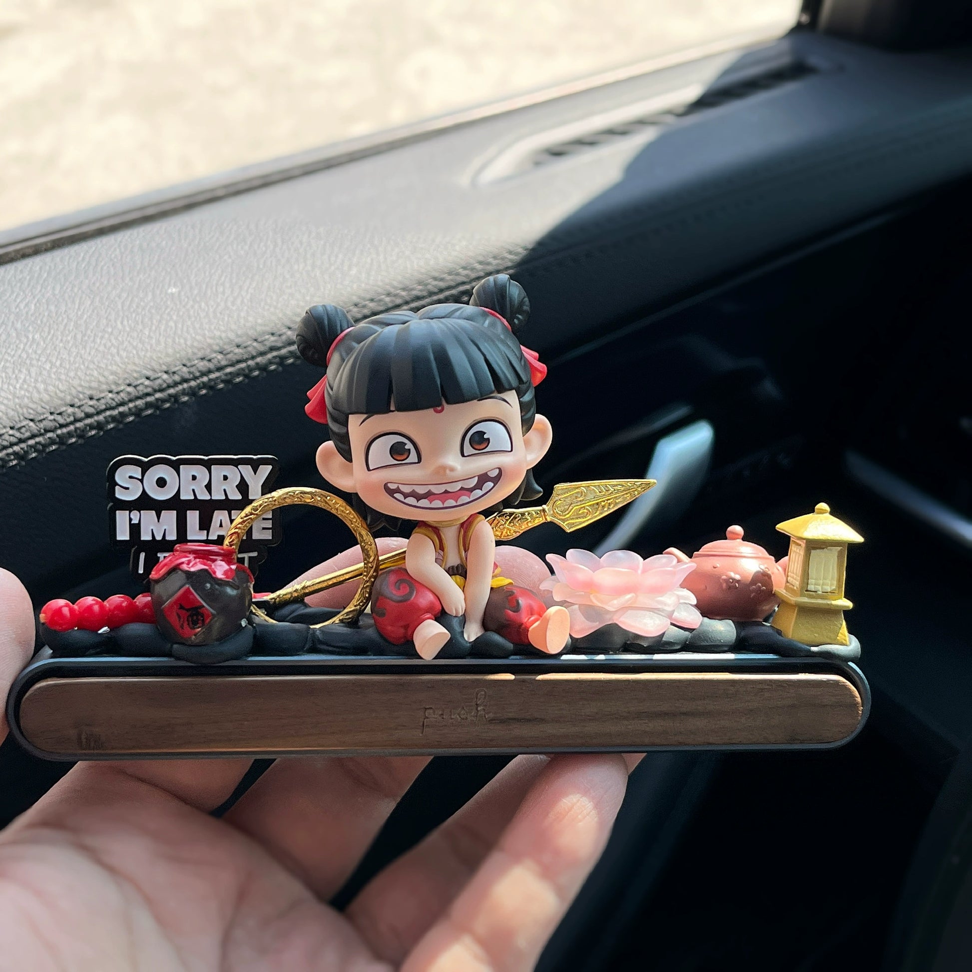 nezha inspired cute dashboard figure with gold spear and hidden parking plate