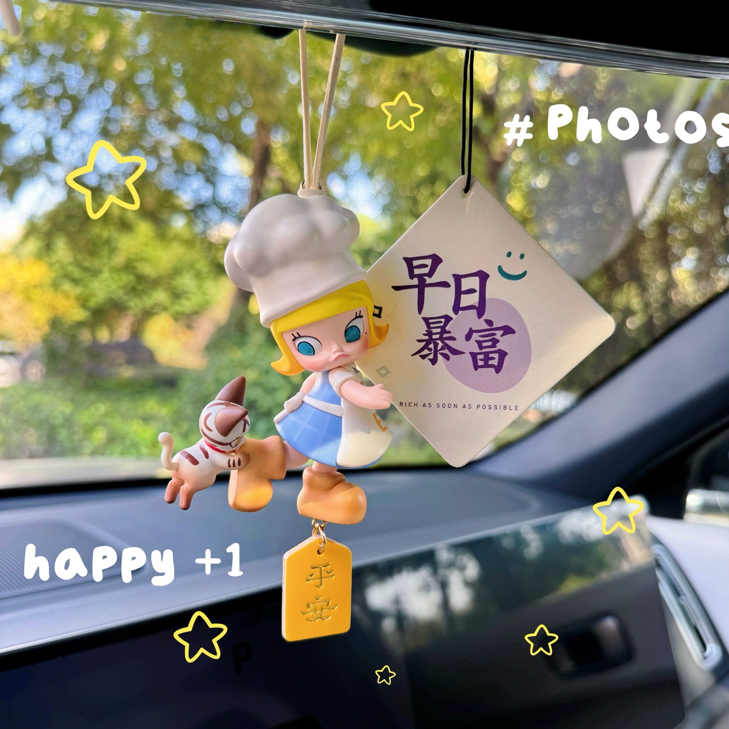 Luvbubu SweetDrive Girl dashboard doll in pink dress with good luck charm tag hanging in car interior