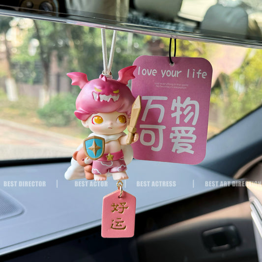 Dreamoo sailor figurine with blue orb and red Peace & Joy tag on car dashboard – soft aesthetic collectible charm