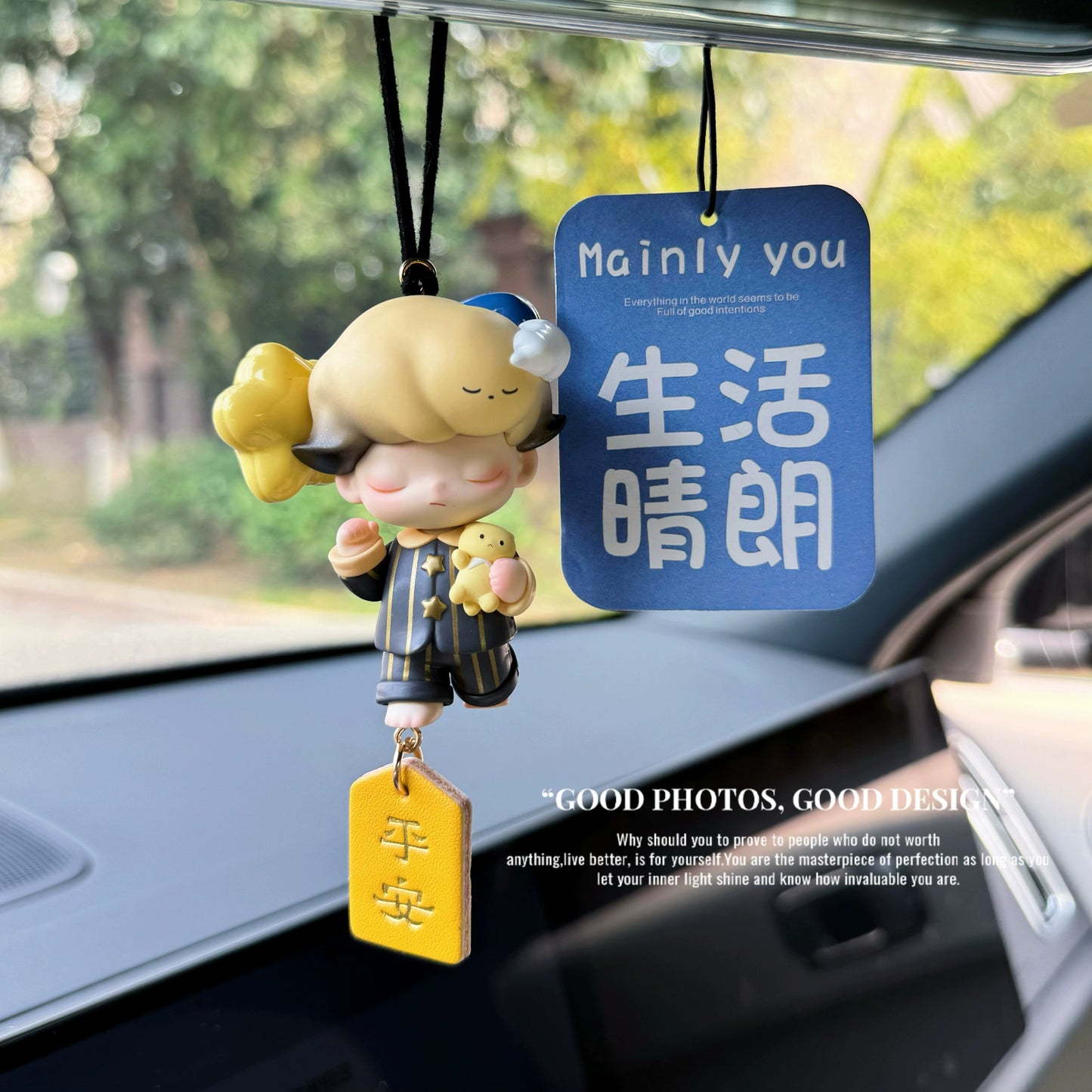 Dreamoo sailor figurine with blue orb and red Peace & Joy tag on car dashboard – soft aesthetic collectible charm