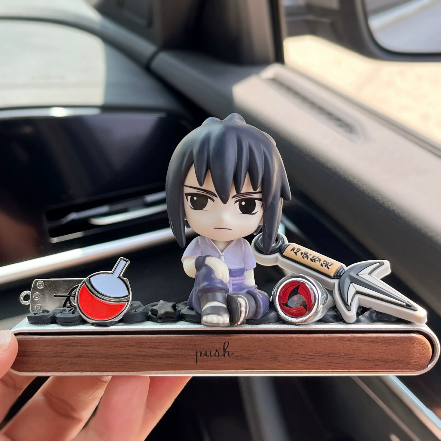 Ninja anime-style dashboard ornament with hidden magnetic parking number plate and gift box